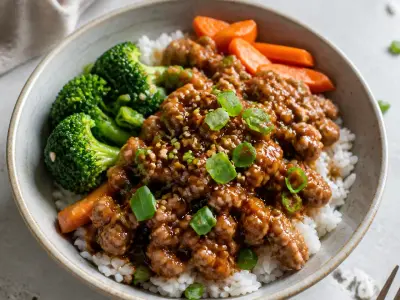 Teriyaki ground turkey rice bowls with broccoli, carrots, and scallions
